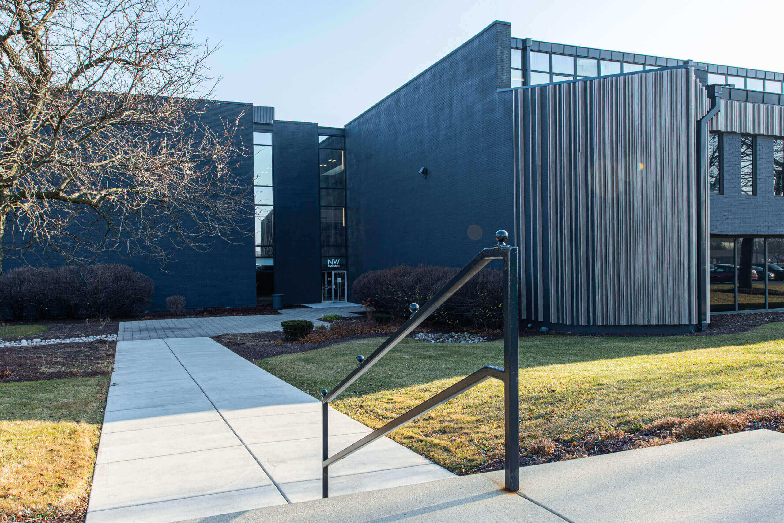 A black fence is in front of a building.