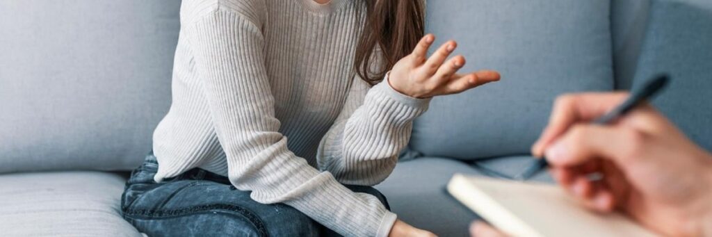 Person talking and gesturing during a session.